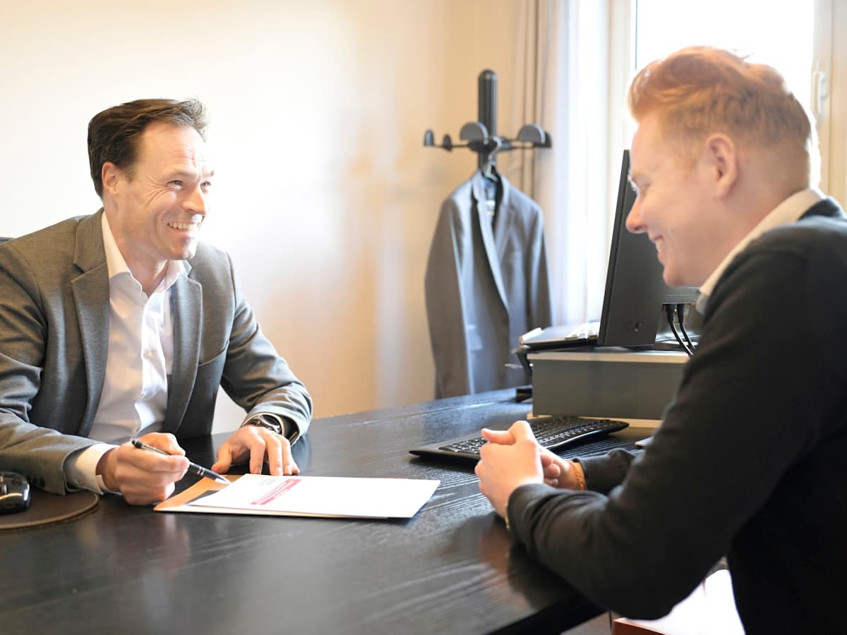 A counsellor and a student talking across a desk